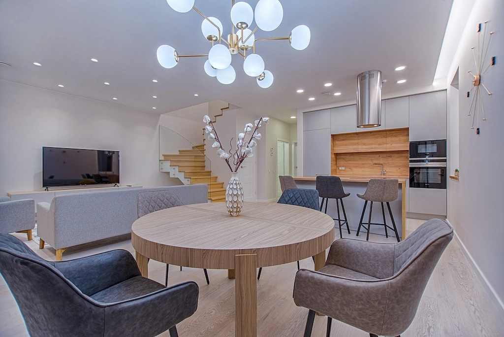 Spotless Living Room With Round Wooden Table